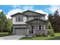 Charming two-story home featuring craftsman-style architecture with a covered porch and professionally landscaped yard at 8259 Rockvale Dr, Littleton, CO 80125