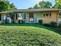 Charming single-story home featuring a lush green lawn and a well-maintained exterior at 2814 S Winona Ct, Denver, CO 80236