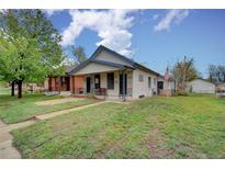 Charming single-Gathering home with a well-manicured lawn and classic architectural details at 4514 Bryant St, Denver, CO 80211