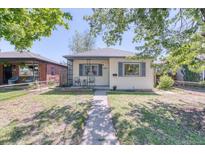 Charming home with a well-manicured lawn, inviting walkway, and a welcoming facade at 2684 S Logan St, Denver, CO 80210