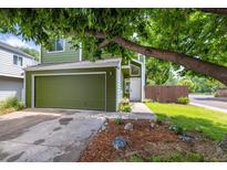 Charming home featuring an attached garage, verdant lawn, and inviting front entrance at 4129 Amber St, Boulder, CO 80304