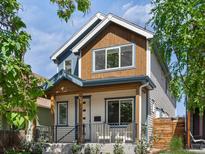 Charming two-story home boasts a blend of modern design and classic appeal, complete with a welcoming front porch and tasteful finishes at 3640 Lipan St, Denver, CO 80211