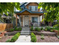 Charming home featuring a welcoming front porch, landscaped yard, and inviting curb appeal at 3640 Lipan St, Denver, CO 80211