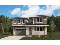 Charming two-story home features a stone pillar porch, modern windows and attached two car garage at 4609 Thistle Dr, Brighton, CO 80601