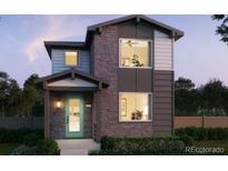 Charming two-story home with a mix of stone and siding, plus a light blue door and covered porch at 21001 E 63Rd Dr, Aurora, CO 80019