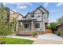 Stunning two-story home with modern gray exterior and landscaped front yard at 3908 Mariposa St, Denver, CO 80211