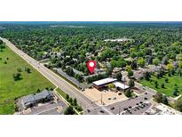 Aerial view showcases property's proximity to a lush, tree-filled community and convenient access to the main road at 4856 E Hinsdale Pl, Centennial, CO 80122