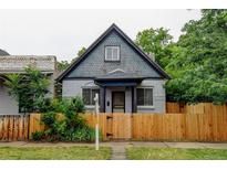 Charming bungalow with a fenced yard and classic architectural details at 1707 W 39Th Ave, Denver, CO 80211