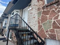 Street view of home with white door and a mix of brick and stone detail on the front exterior at 1285 Colorado Blvd # 3, Denver, CO 80206