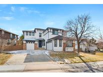 Well-maintained two-story home featuring a three-car garage and attractive curb appeal at 11010 Grayledge Cir, Highlands Ranch, CO 80130