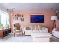 Inviting living room with comfortable seating, decorative shelves, and stylish decor at 2557 S Dover St # 85, Lakewood, CO 80227