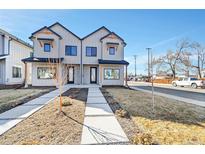 Charming two-story townhome with modern design elements and inviting front yard at 4101 S Lincoln St, Englewood, CO 80113