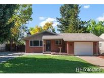 Charming ranch-style home with a well-manicured lawn and a cozy, inviting entrance at 4585 S Elati St, Englewood, CO 80110