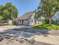 Charming condominium complex featuring a gray exterior and well-maintained landscaping at 2490 S Worchester Ct # E, Aurora, CO 80014