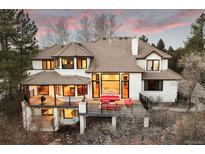 Expansive, two-story home with a large deck and outdoor seating, perfect for entertaining at 851 Swandyke Dr, Castle Rock, CO 80108