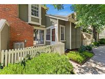 Charming townhouse with a well-kept front yard and a white picket fence at 2013 S Helena St # B, Aurora, CO 80013