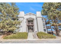 Exterior of charming multi-Gathering home with balconies and professionally landscaped front yard at 17493 E Mansfield Ave # 1231L, Aurora, CO 80013