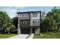Modern two-story home showcasing a minimalist design, large windows, and a welcoming front entrance, all surrounded by lush greenery at 7199 Waterleaf Trl, Littleton, CO 80125