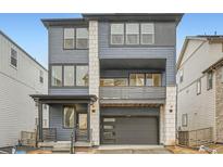 Charming two-story home featuring a private balcony and attached two-car garage at 7199 Waterleaf Trl, Littleton, CO 80125
