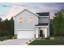 Two-story home boasts a gray exterior, two-car garage, landscaped front yard, and covered front porch at 2222 Flower Blossom Ave, Brighton, CO 80601
