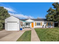 Charming ranch-style home featuring a well-maintained lawn and inviting curb appeal at 3350 S Forest St, Denver, CO 80222