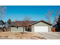 Charming single-story home with a well-maintained yard and a two-car attached garage at 9379 Grandview Ave, Arvada, CO 80002
