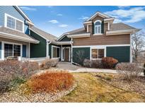 Charming two-story home boasts a well-maintained front yard and inviting exterior at 9118 W 50Th Ln # 3, Arvada, CO 80002