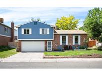 Charming two-story home featuring brick and siding, a well-maintained front yard, and a two-car garage at 11345 Marshall Ct, Westminster, CO 80020