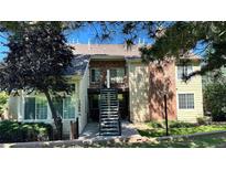 Charming two-story condo with brick accents, front garden and outdoor stairs at 13894 E Lehigh Ave # G, Aurora, CO 80014