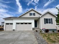 Charming single-Gathering home featuring a three-car garage, complemented by a beautifully maintained front yard at 229 Wooten Ave, Brighton, CO 80601