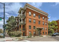 Charming brick apartment building featuring classic architecture and private balconies, offering urban living in a historic setting at 1376 N Pearl St # B1, Denver, CO 80203