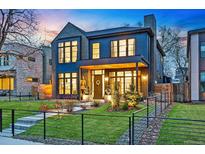 Stunning two-story home featuring a landscaped yard, modern architecture, and a welcoming front porch at 1130 S Cook St, Denver, CO 80210