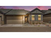 Charming single-Gathering home with a well-maintained two-car garage and stone-accented facade at 11791 Barrentine Loop, Parker, CO 80138