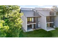 Two story house exterior featuring a cozy balcony and well-maintained lawn at 6519 Pinewood Dr, Parker, CO 80134