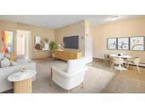 Bright living room with modern decor, including a TV, stylish furniture, and neutral color palette at 1045 N Pennsylvania St # 303, Denver, CO 80203