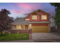 Charming two-story home with a manicured lawn and welcoming curb appeal at 5784 W 81St Cir, Arvada, CO 80003