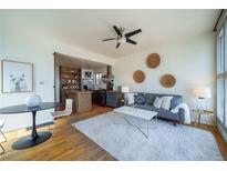 Inviting living space with modern decor, seamlessly connected to a stylish kitchen at 3735 Inca St, Denver, CO 80211