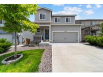 Charming two-story home with a well-maintained lawn and a two car garage in a desirable neighborhood at 3344 Evening Pl, Castle Rock, CO 80109