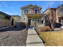 Two-story house with front porch and landscaping at 4723 Joplin St, Denver, CO 80239