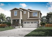 Two-story house with a stone facade and a two-car garage at 9352 Yampa St, Commerce City, CO 80022