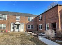 Charming brick townhomes featuring well-maintained lawns and inviting entrances at 2856 Jasmine St, Denver, CO 80207