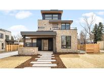 Modern stone facade with a covered front porch, balcony and contemporary design elements at 2170 Vine Ave, Boulder, CO 80304