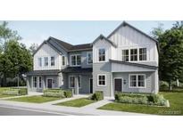 Charming two-story home featuring a modern design with gray and white color scheme, and well-manicured lawn at 6639 N Parterre Pkwy # 1, Thornton, CO 80602