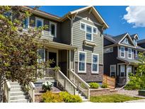 Charming two-story home with well-maintained landscaping, inviting front porch and beautiful architectural details at 17706 Cherokee St, Broomfield, CO 80023