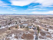 Modern home with circular roofline nestled on a hillside with scenic views at 1175 Ridge Oaks Dr, Castle Rock, CO 80104