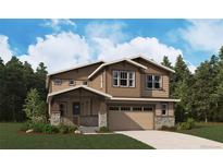 Stunning two-story home with a covered porch, attached two-car garage, and a beautifully landscaped front yard at 24768 E 40Th Ave, Aurora, CO 80019