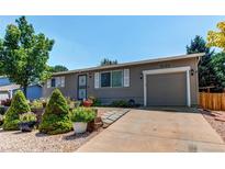 Charming single-story home with well-maintained landscaping and an attached one car garage at 6120 W 111Th Ave, Westminster, CO 80020