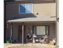 Inviting front porch with charming seating area offers a cozy welcome to this lovely home at 473 N Banner St # B, Elizabeth, CO 80107