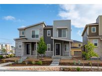 Charming two-story home featuring a modern design with stone accents and a well-manicured front yard at 5319 Warrior St, Frederick, CO 80504