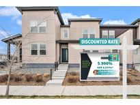 Attractive two-story home featuring a modern design, a welcoming entryway, and professional landscaping at 4755 Memphis St # 2, Denver, CO 80239
